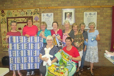 The Samford Charity Craft Group with their handmade items.