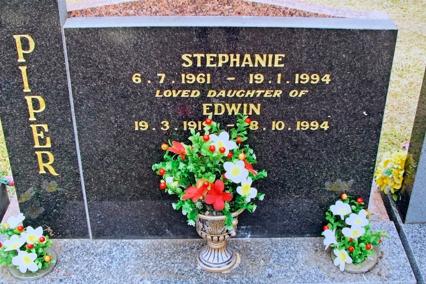 A gravestone for Stephanie indicating she lived from 1961 until 1994, loved daughter of Edwin