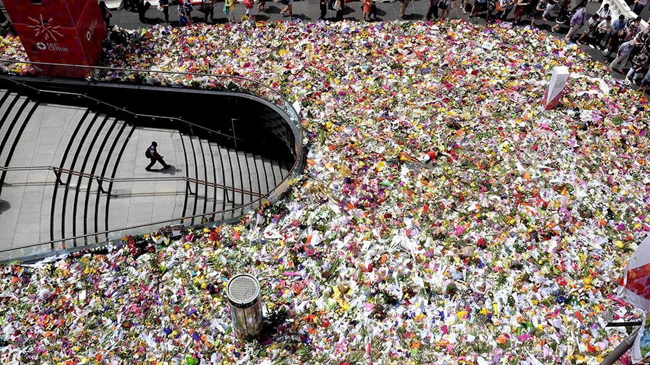 Floral tributes for victims of the Lindt Chocolate Cafe siege fill Martin Place in Sydney, close to where the siege took place.