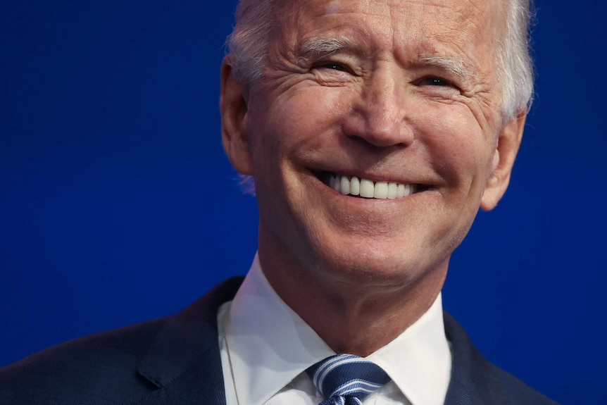 Joe Biden with a big grin on his face