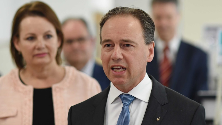 Greg Hunt speaking at a press conference