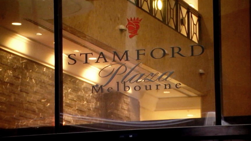 The window of the Stamford Plaza Melbourne with the building's luxurious old interior in the background.