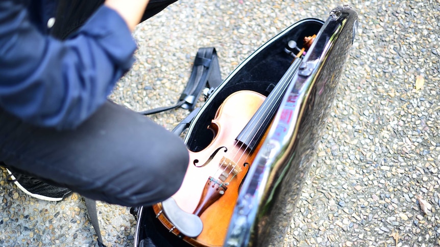 Violin in its case on the ground