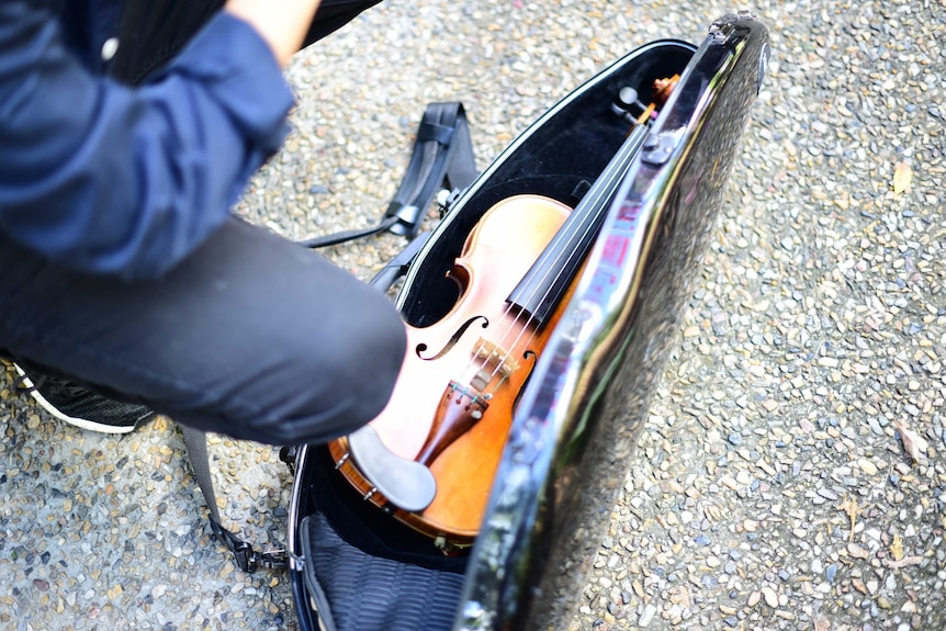 Violin in its case on the ground