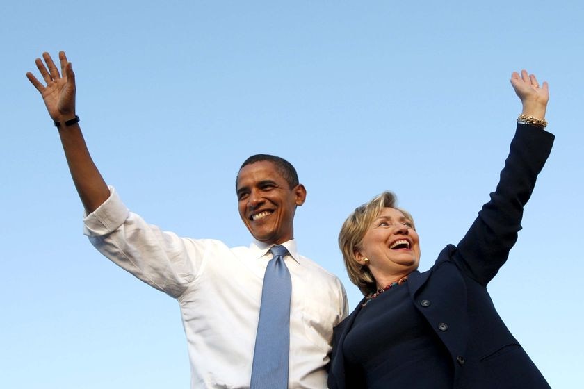 Barack Obama and Senator Hillary Clinton wave to a crowd
