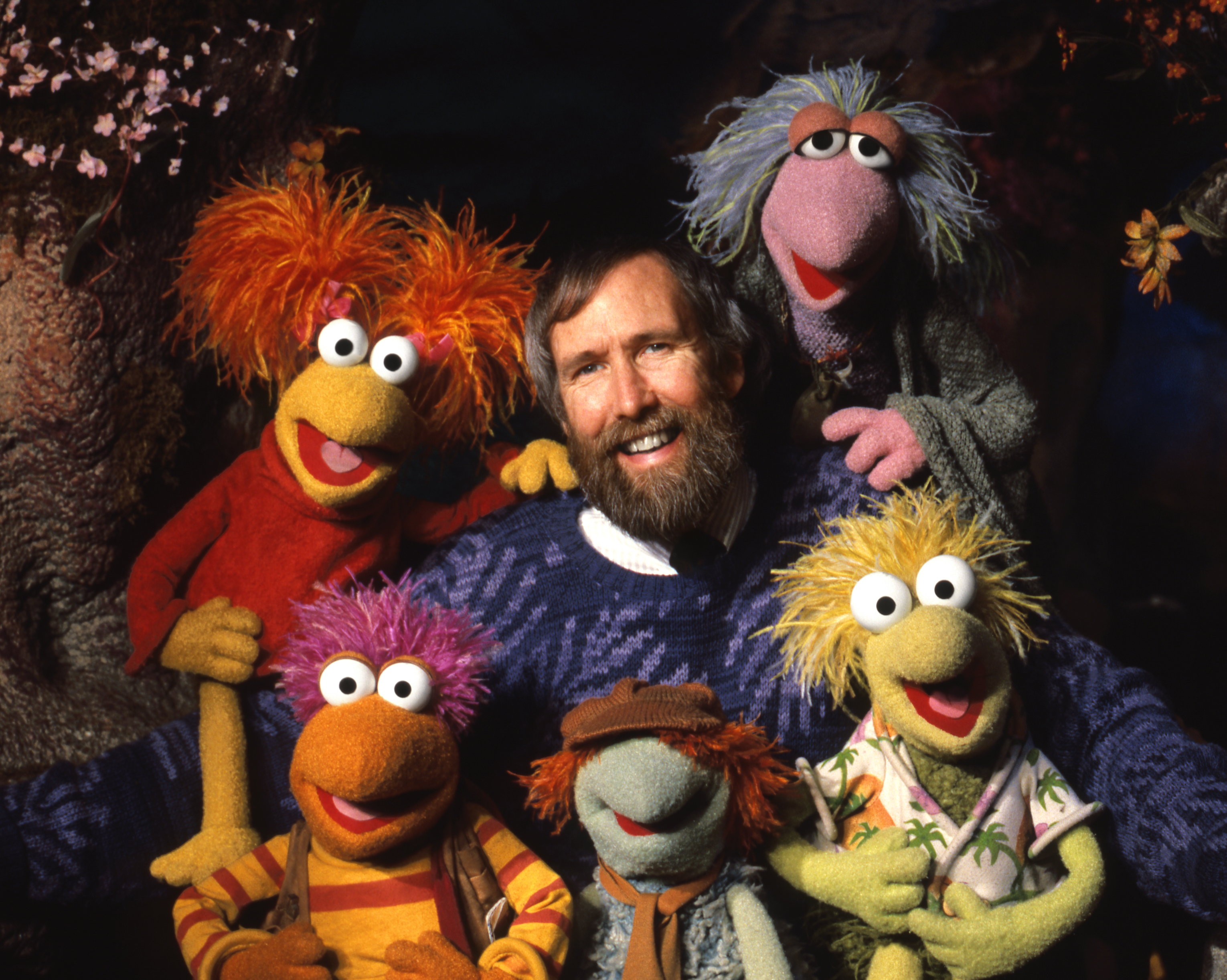 Jim Henson with some of his creatures on the set of Fraggle Rock.