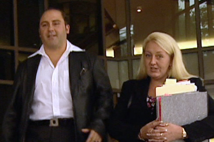 Tony Mokbel and Nicola Gobbo walk away from a Melbourne court.