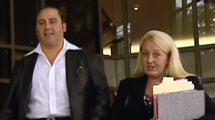 Tony Mokbel and Nicola Gobbo walk away from a Melbourne court.