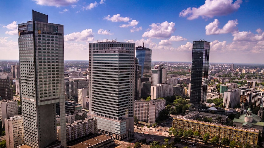 Aerial picture shows skyscrapers, roads and parks in Warsaw.