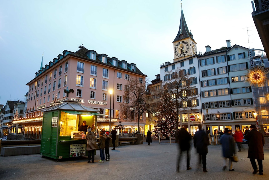 A stall offering roasted chestnuts in front of the Hotel Storchen in Zurich, Switzerland