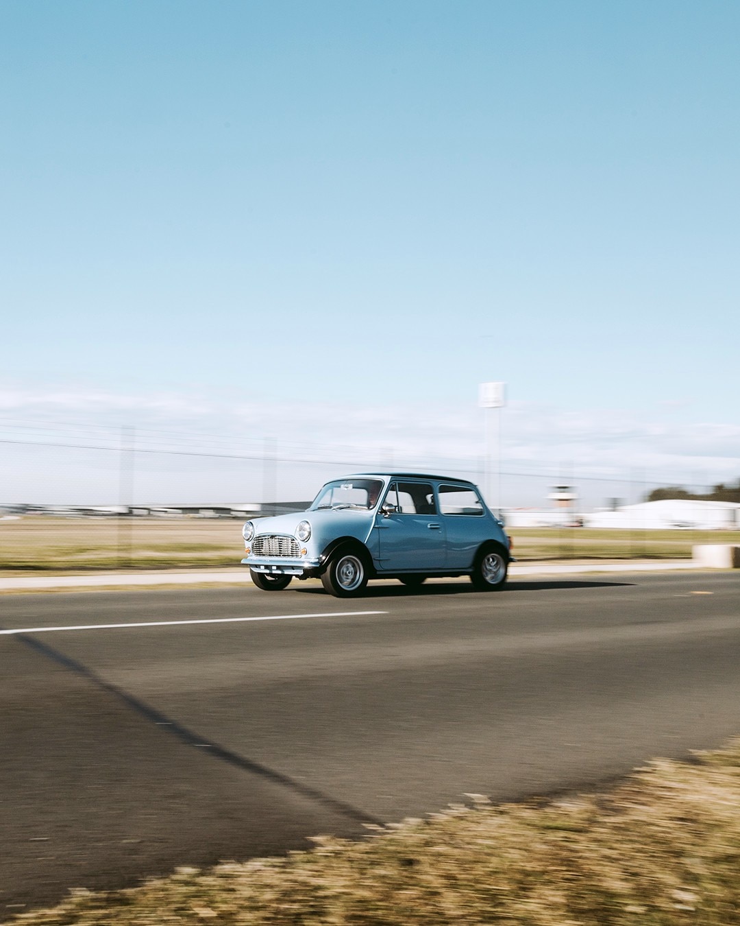 Blue small car on the road