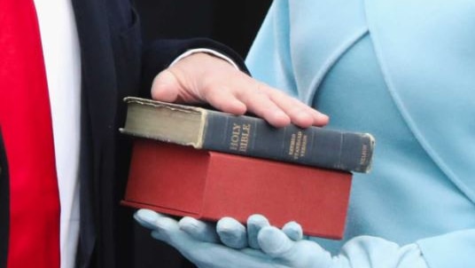 Donald Trump's hand on a Bible during his swearing in as US President