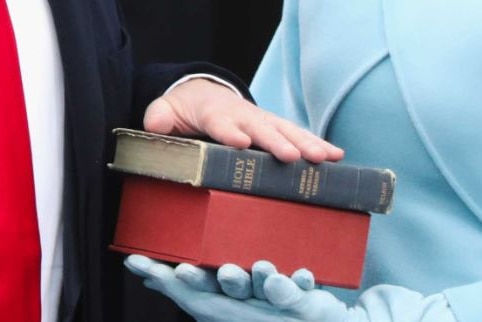 Donald Trump's hand on a Bible during his swearing in as US President
