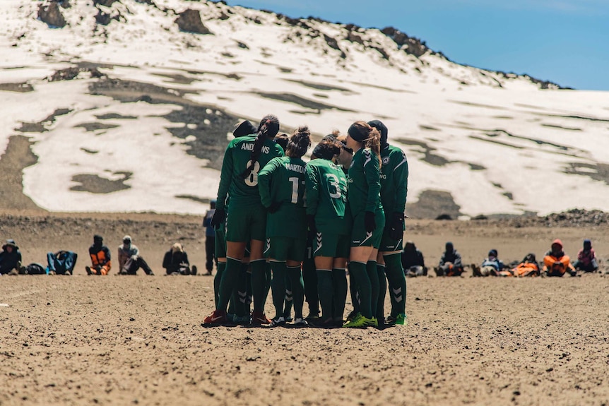 EPF pre-match huddle on Mount Kilimanjaro