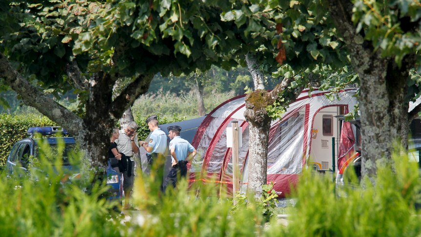 Gendarmes inspect campsite