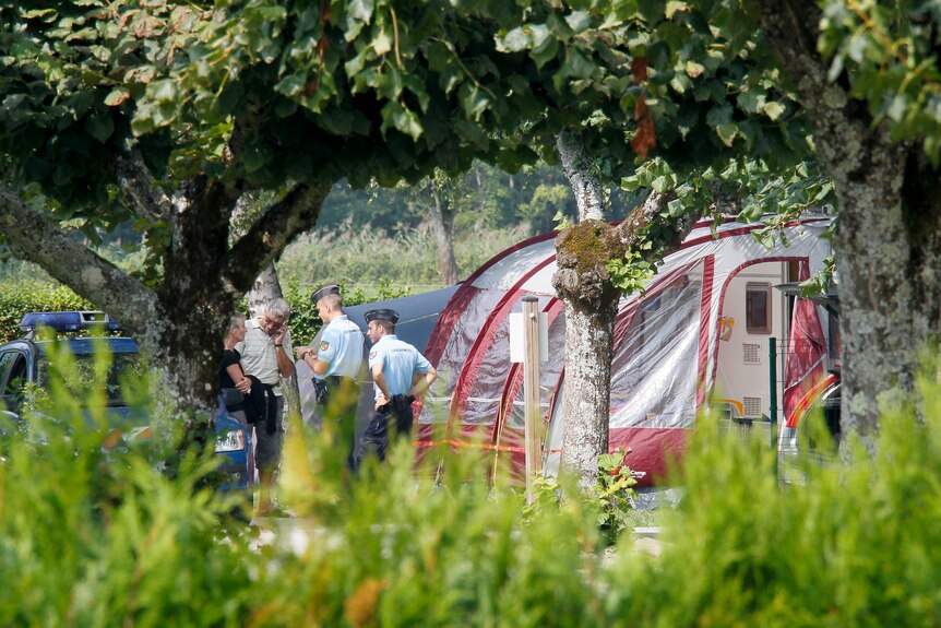 Gendarmes inspect campsite