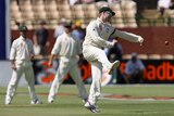 Michael Clarke fires the ball at the stumps