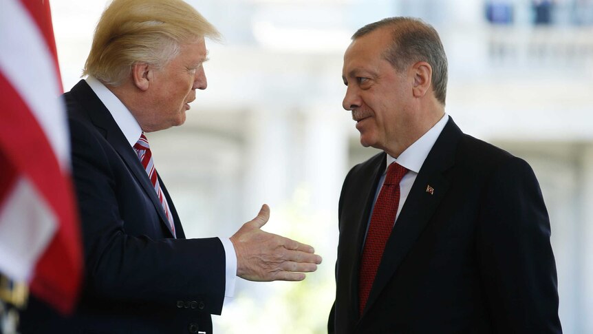 Donald Trump talks with Turkey's President Recep Tayyip Erdogan at the White House.