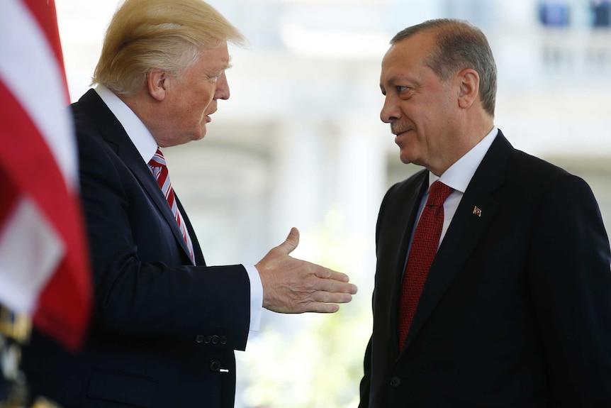 Donald Trump talks with Turkey's President Recep Tayyip Erdogan at the White House.