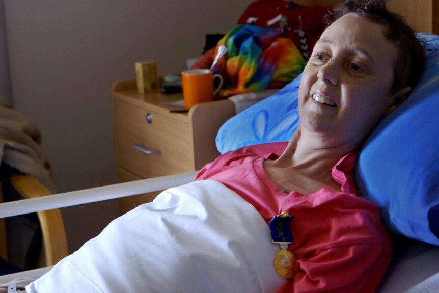 Connie Johnson laying in hospice bed
