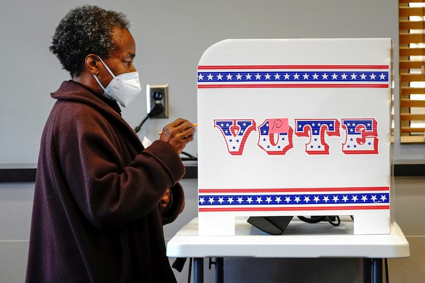 Ruby Lenora casts her in-person vote on her 73rd birthday