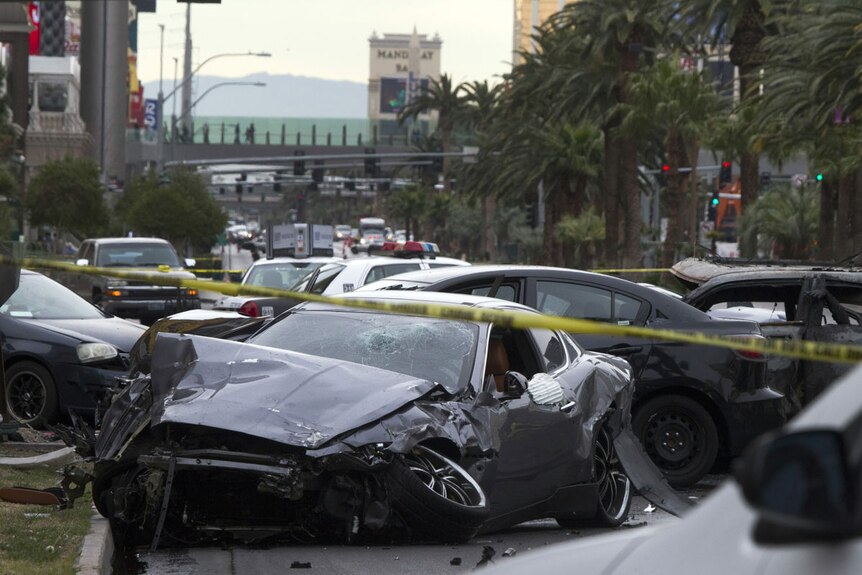 Wrecked cars are seen on Las Vegas Boulevard following a drive-by, Feb 21 2013