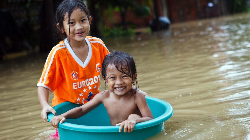 Girls play in floodwaters in Siem Reap, September  2011.