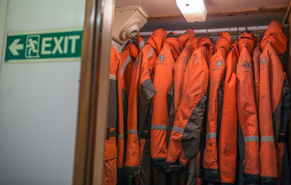 Cold weather deckhand suits hand in closet