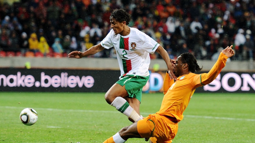 Drogba lunges for the ball