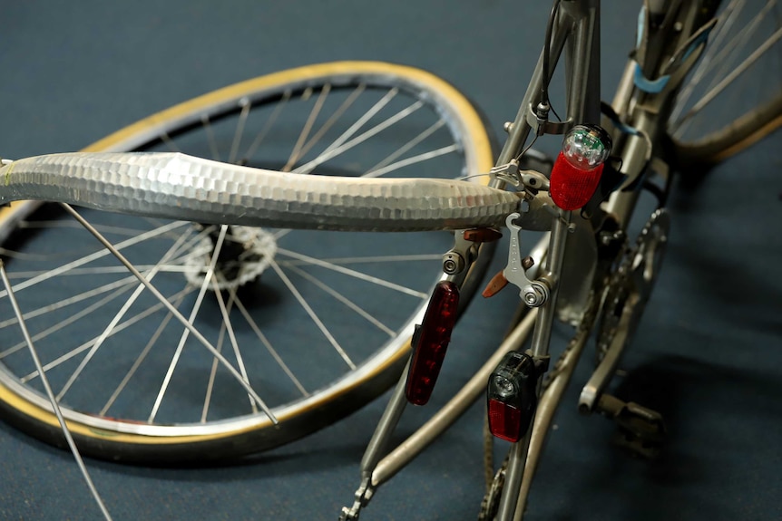 A damaged bicycle tyre and frame