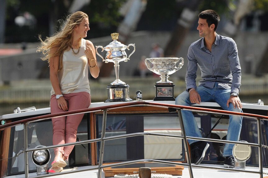 Arriving in style ... Victoria Azarenka (L) and Novak Djokovic rock up to the draw with their trophies.
