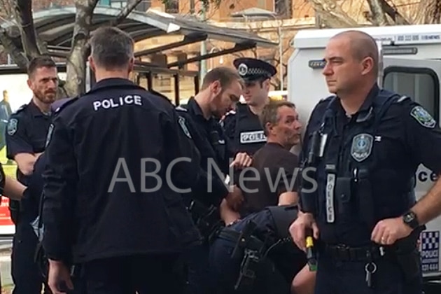 Police surround Gordon Marshall as he is taken into custody