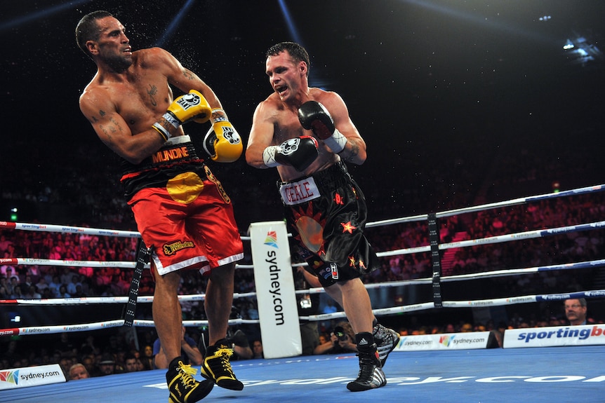 Daniel Geale throws a punch at Anthony Mundine