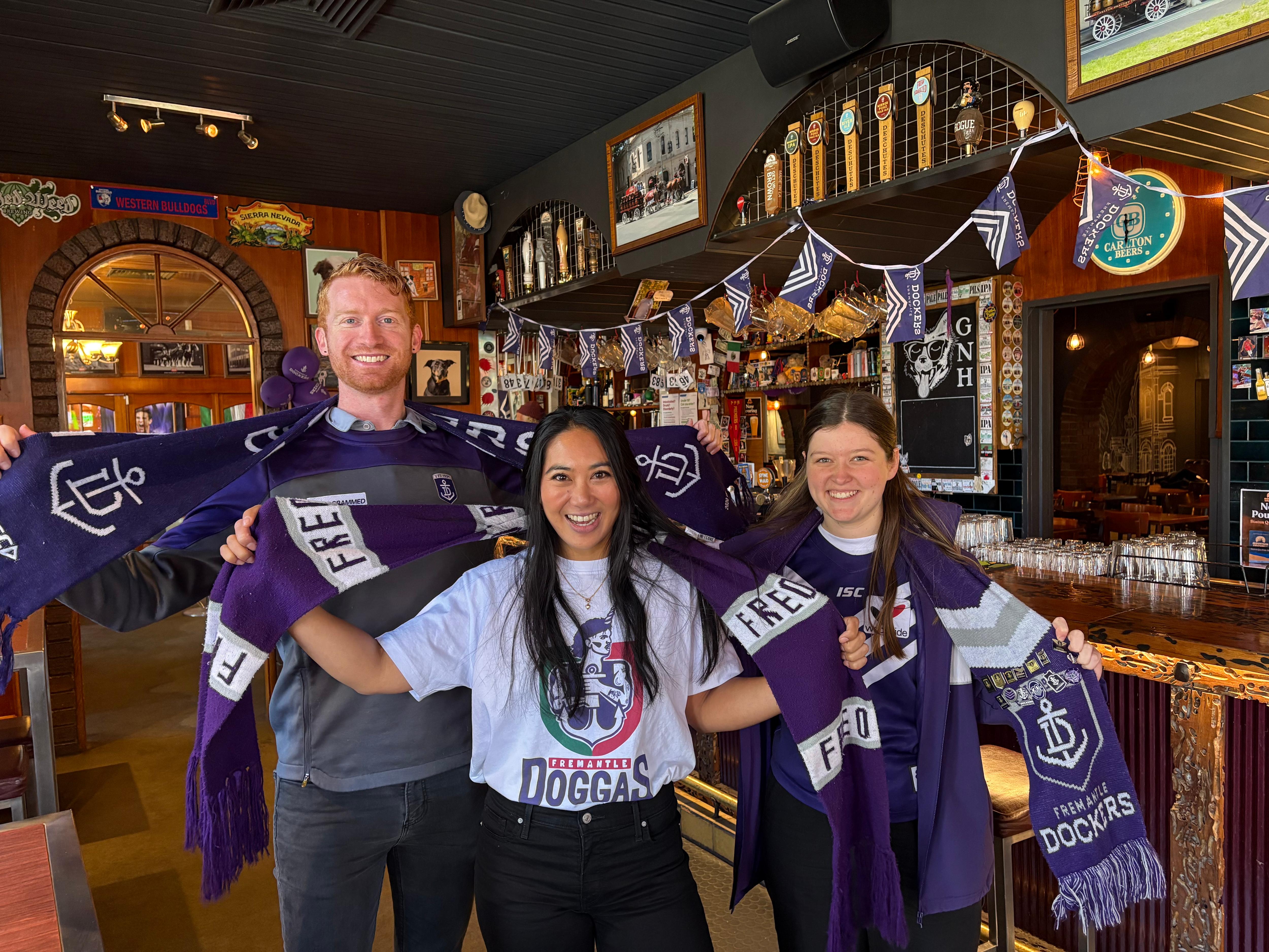 Fremantle and Brisbane AFL fans find 'homes away from home' in Melbourne