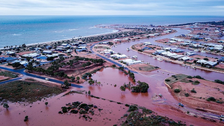 An aerial view of a flooded coastal town.