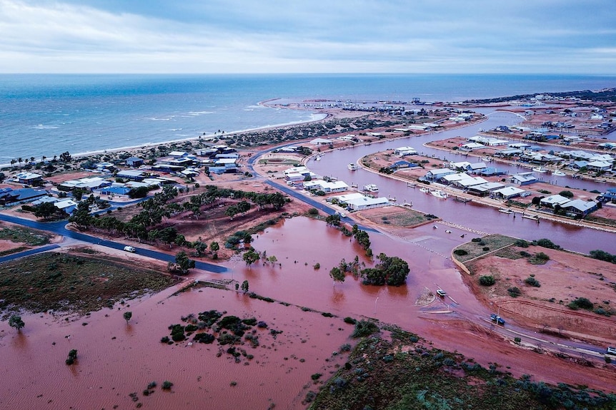 An aerial view of a flooded coastal town.