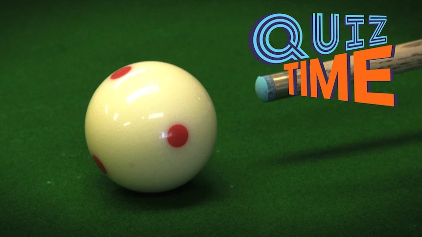 A white ball on a billiard table about to be struck by a cue.