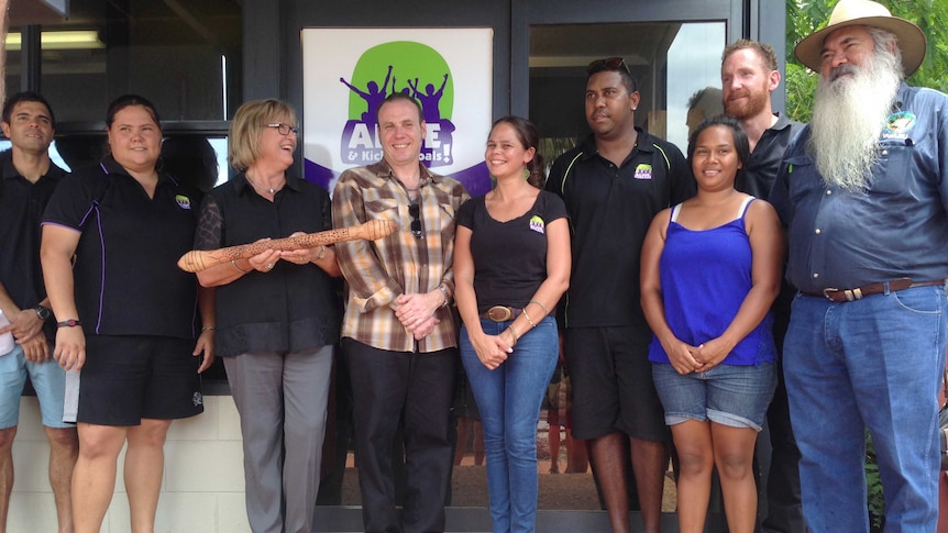 Helen Morton holds the 'baton of life' with Alive and Kicking team in Broome.jpg