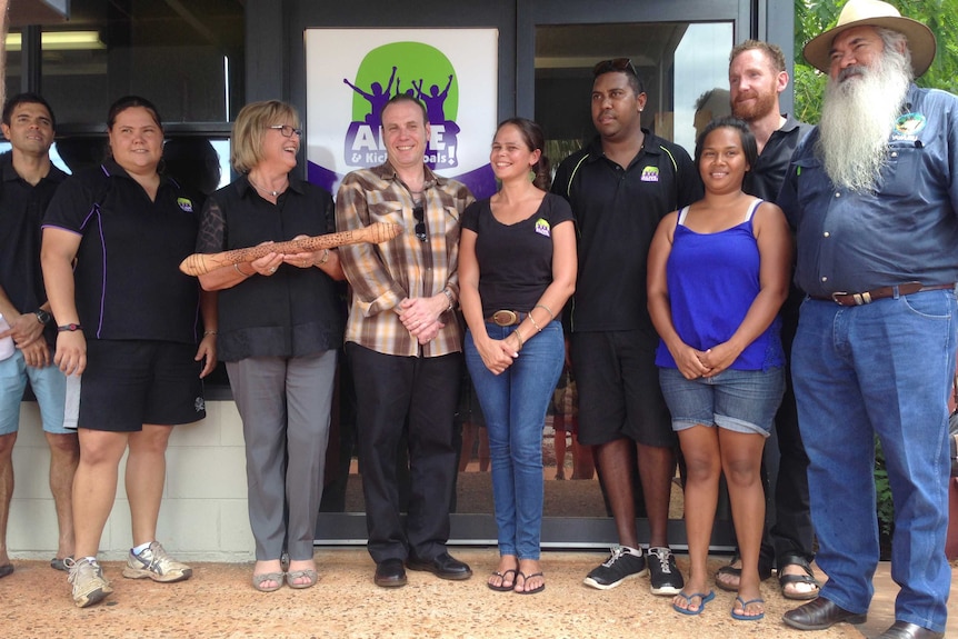 Helen Morton holds the 'baton of life' with Alive and Kicking team in Broome.jpg