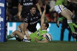 Canberra five-eighth Terry Campese scores against the Panthers at Penrith Stadium