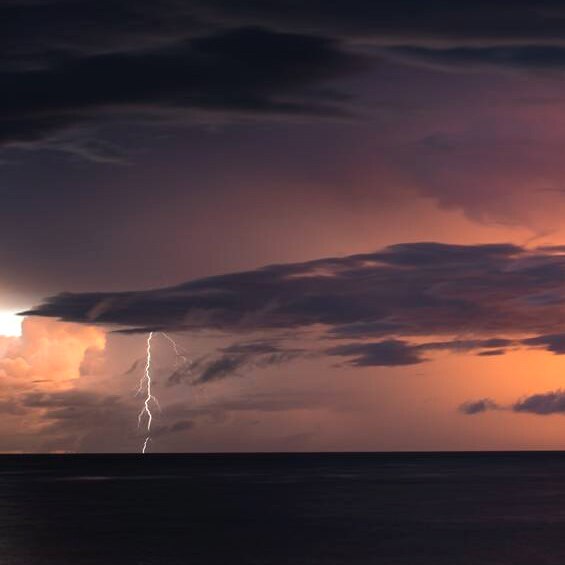 A lightning strike over the ocean illuminates the Kimberley skyline, as a cyclone approaches the coast.
