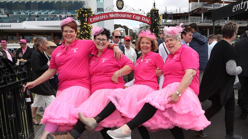 Racegoers wear pink at the 2017 Melbourne Cup at Flemington racecourse.