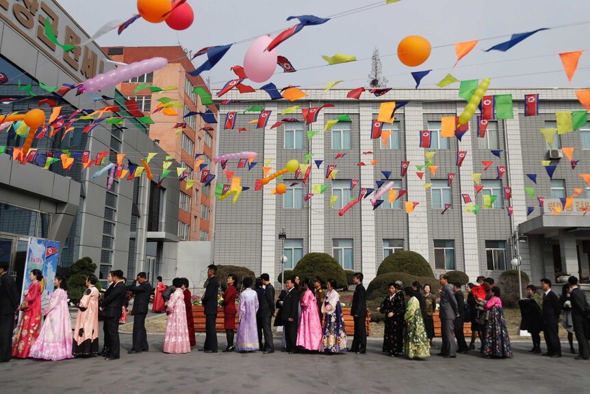 People line up to vote in North Korea's election.