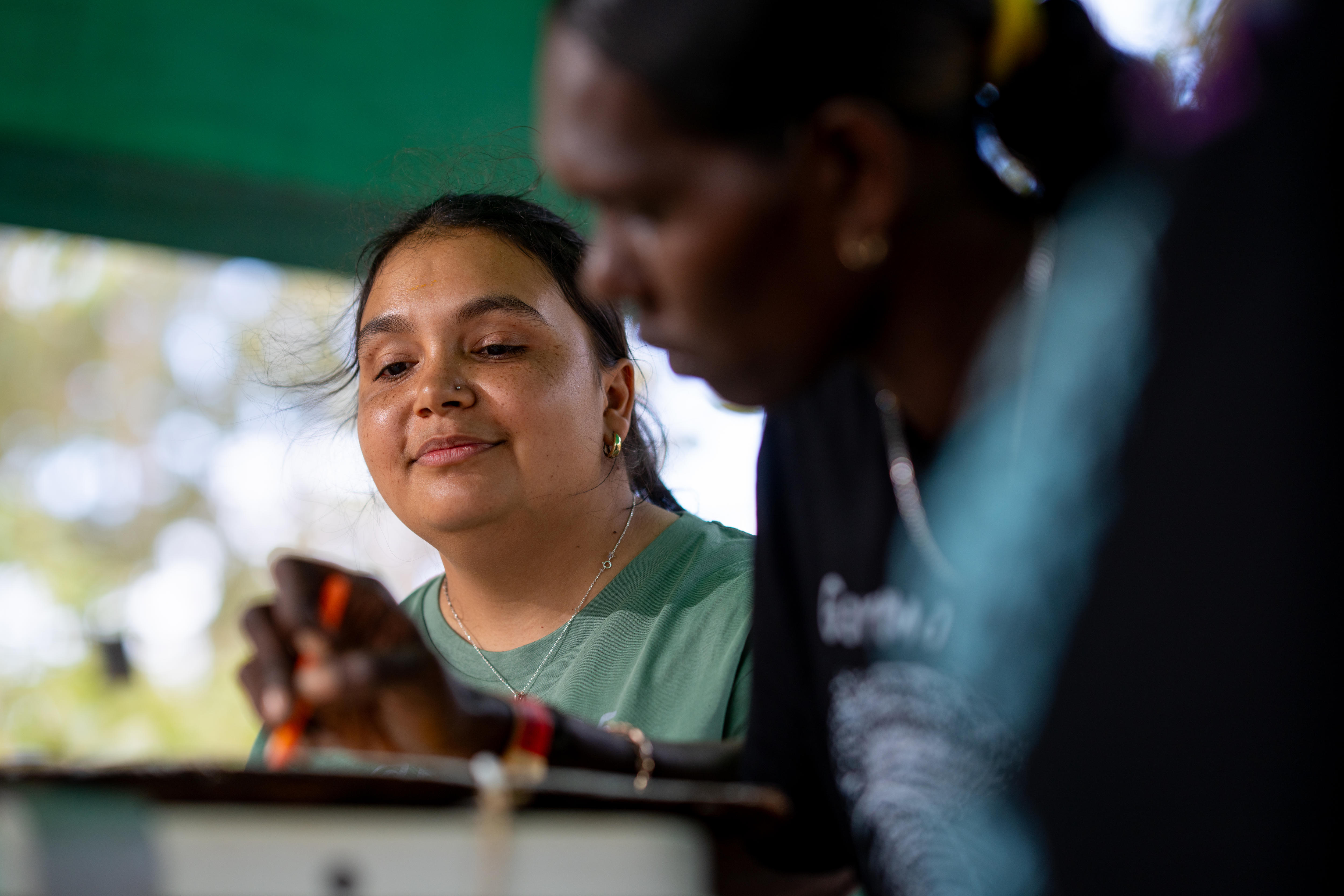 Siena watches on as Savannha paints