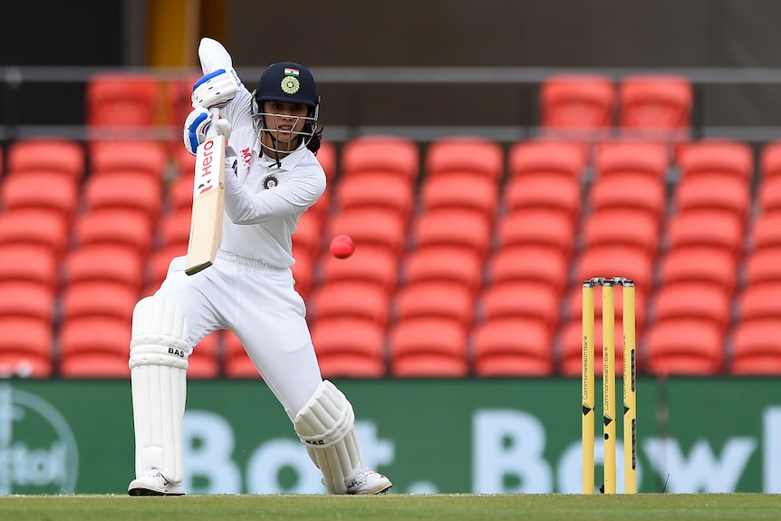 India batter Smriti Mandhana drives the pink ball away during the Test against Australia.