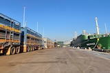 a live export ship being unloaded of cattle onto trucks.