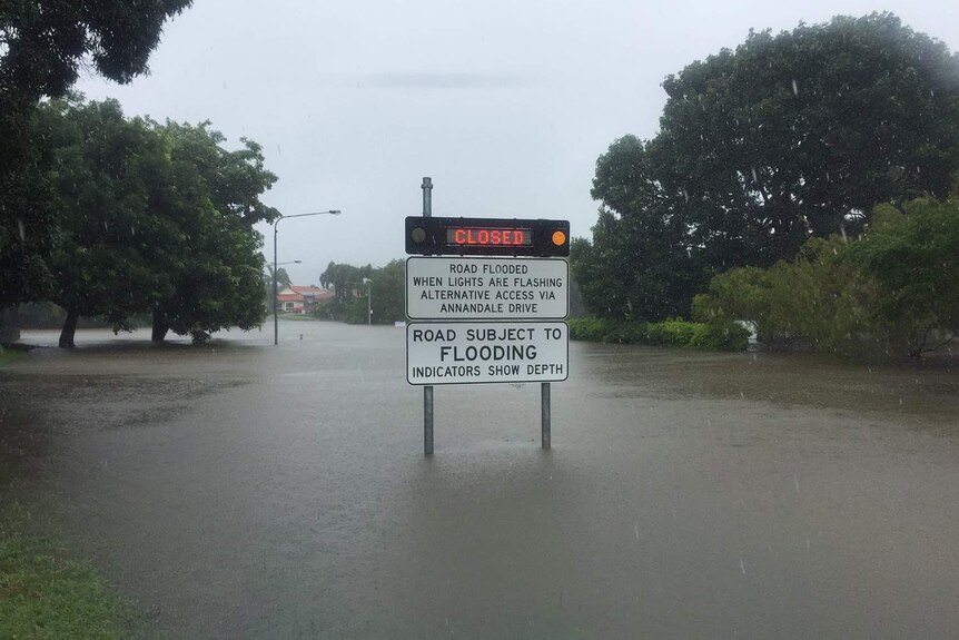 Sign with road closed due to floodwaters in Glendale Drive in Annandale in Townsville