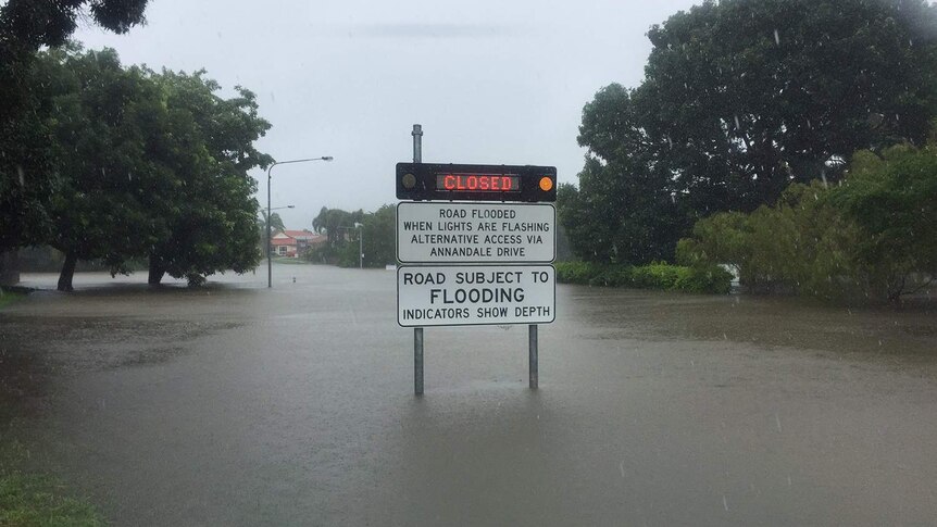 Sign with road closed due to floodwaters in Glendale Drive in Annandale in Townsville