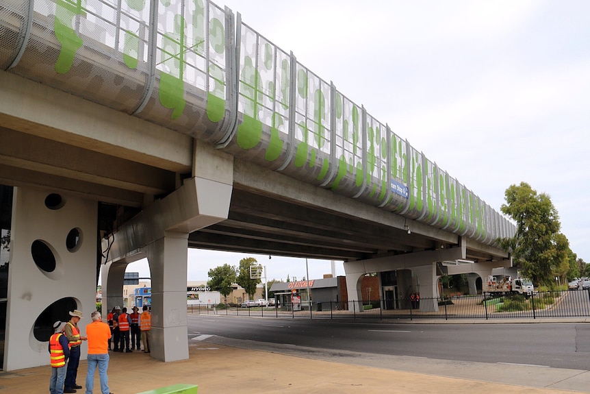 Workmen inspect the South Road overpass.