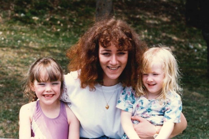 Young toddler wearing nappy with her mother in the early 1980s